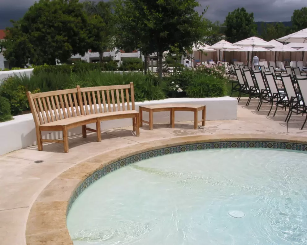 The baby pool and curved bench.