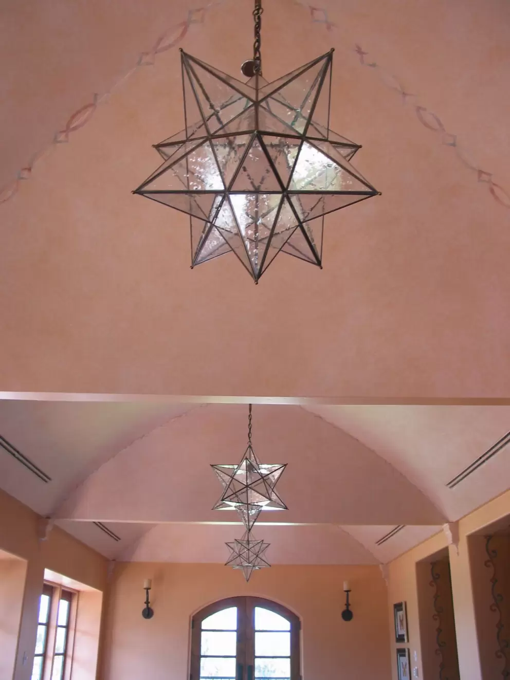 Maravilla Restaurant's pink ceiling and Spanish star chandeliers. 
