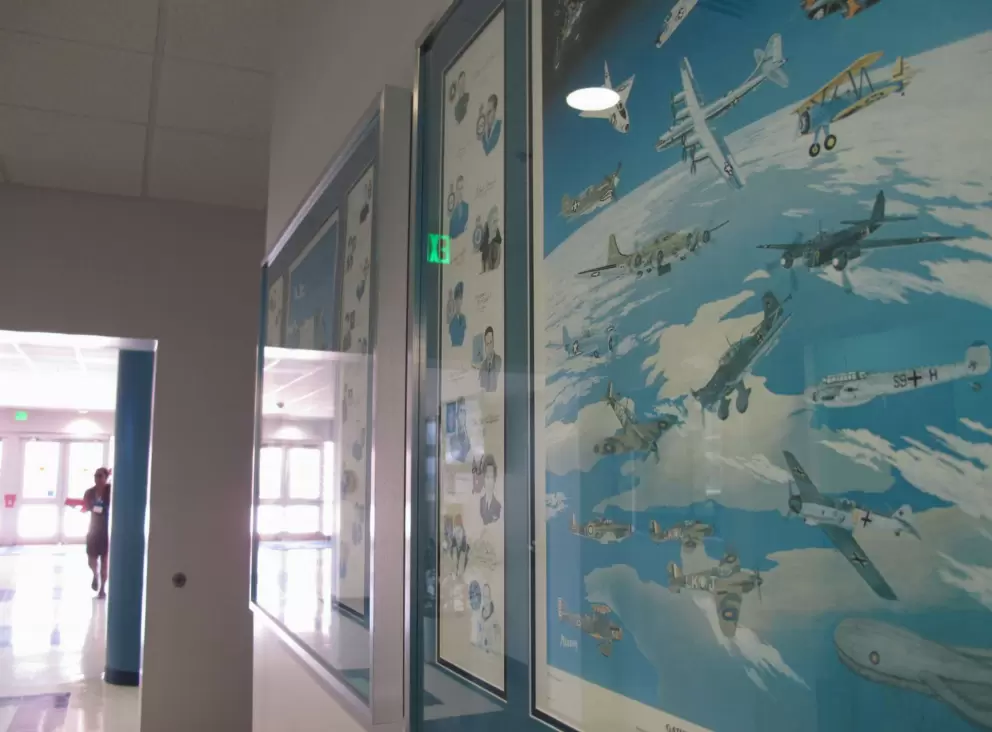 Airplane-inspired posters on the hallway walls.