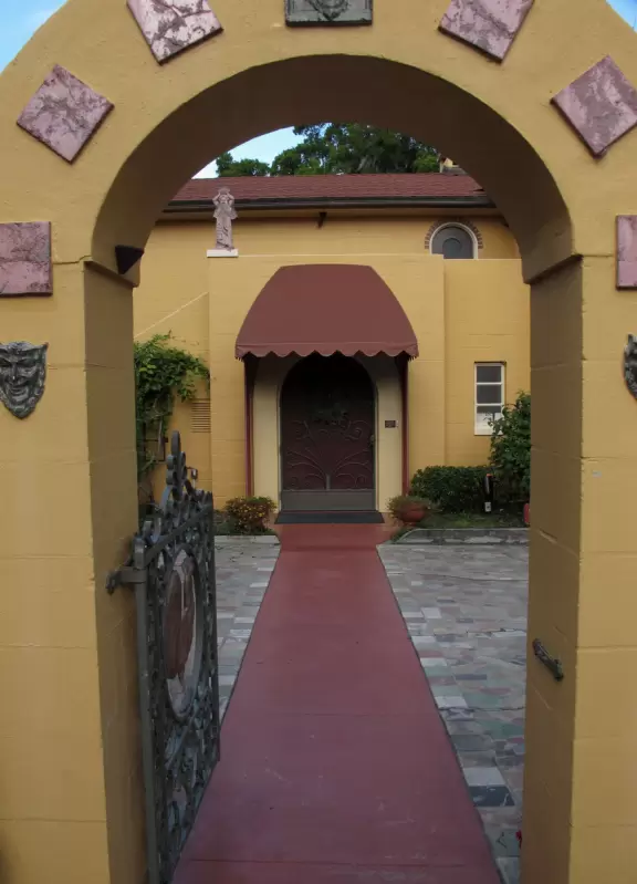 Sweet little house on beautiful plot of land on Lake Osceola, with intimate sculptures in the garden.