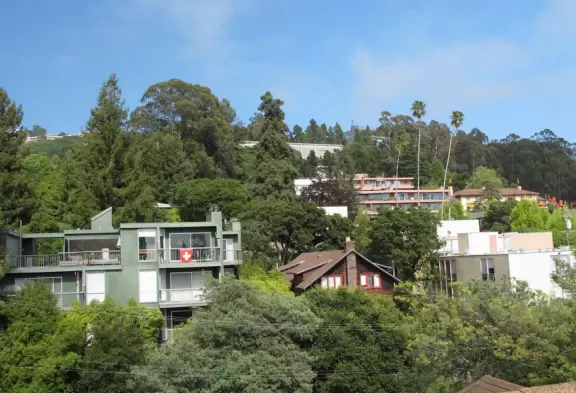 Hilly campus in gorgeous area buzzing with student activity.