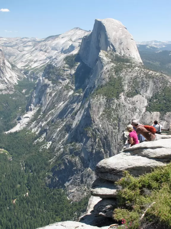 Breathtaking side-on view of half dome, three waterfalls, and the entire stunning valley.