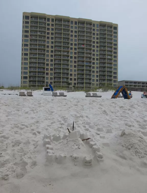 Beach with long pier, creamy blue-green water, and white sand that crinkles under your feet!