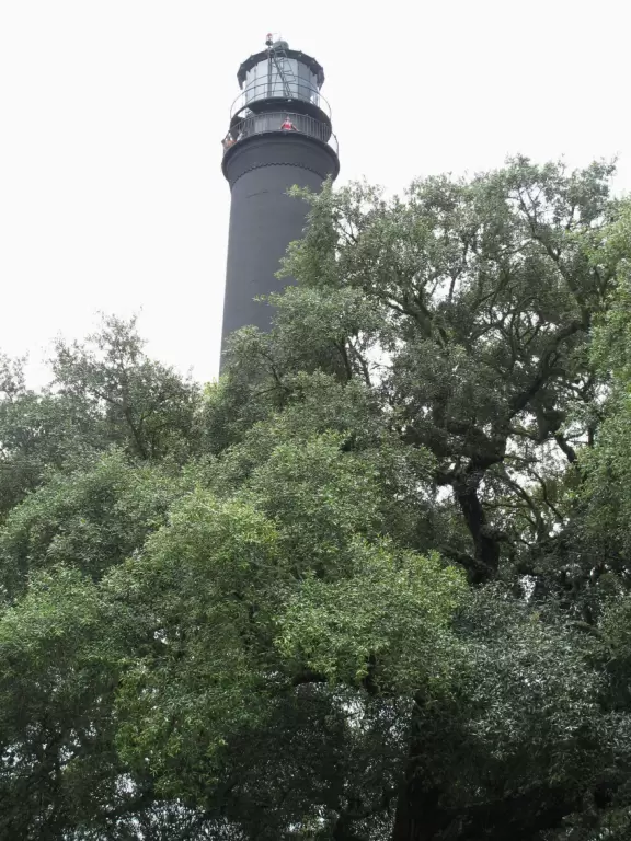 Pretty black and white lighthouse with pleasant views but no overseeing of how many people walk the fragile plank.