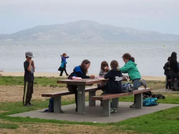 Picnic tables, amphitheater, gift/coffee shop, and wharf, under the Golden Gate Bridge!