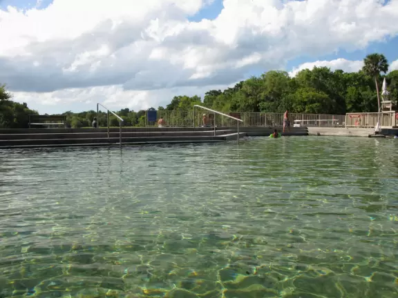 Headspring enclosed in concrete pool, which has advantages and disadvantages.