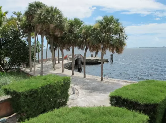 Bayside mansion with stunning waterfront "barge" and colorful geometric gardens.
