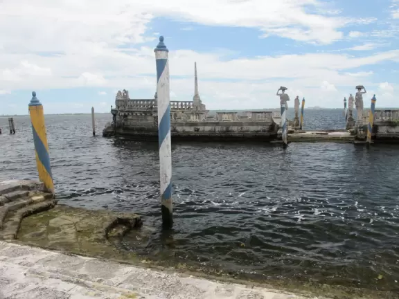 Bayside mansion with stunning waterfront "barge" and colorful geometric gardens.