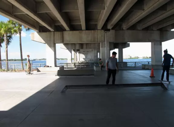 Wonderful development on the water with promenade, space-age playgrounds, splash pad, and skate park shaded by the bridge.
