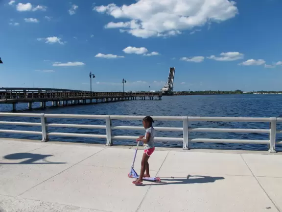 Wonderful development on the water with promenade, space-age playgrounds, splash pad, and skate park shaded by the bridge.