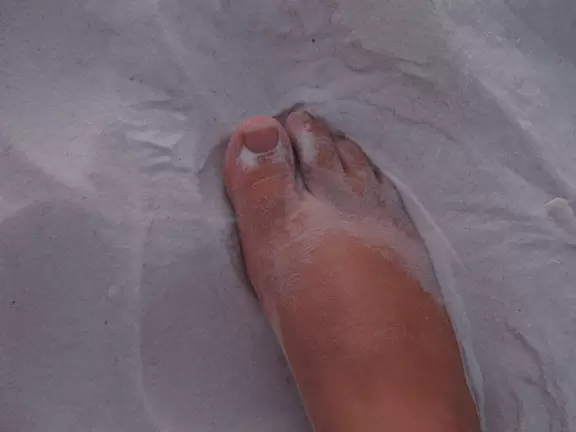 Wide beach with sand as fine as flour and great sunsets.