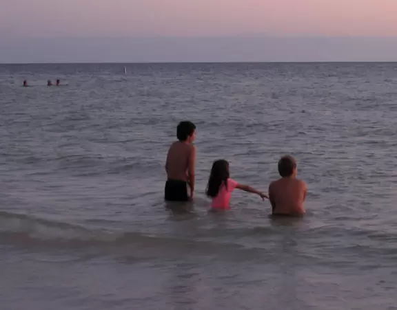 Wide beach with sand as fine as flour and great sunsets.
