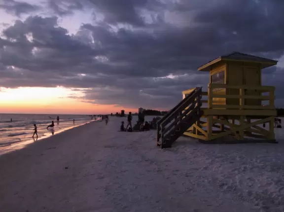 Wide beach with sand as fine as flour and great sunsets.