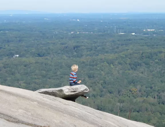 Giant granite mountain with Swiss skylift and village full of fun activities for kids!