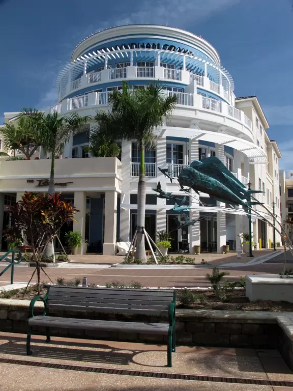 A happening spot with a sunken amphitheater by the water where kids can run in a splash pad and fountains are lit up at night.&nbsp; BurgerFi, Subculture Coffee, and a few restaurants.