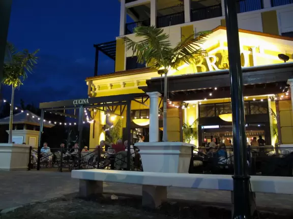 A happening spot with a sunken amphitheater by the water where kids can run in a splash pad and fountains are lit up at night.&nbsp; BurgerFi, Subculture Coffee, and a few restaurants.