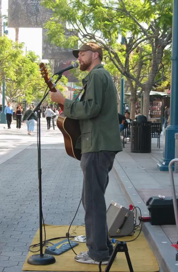 A pretty, pedestrian-only street, with performers, tons of people, and lots of shopping.