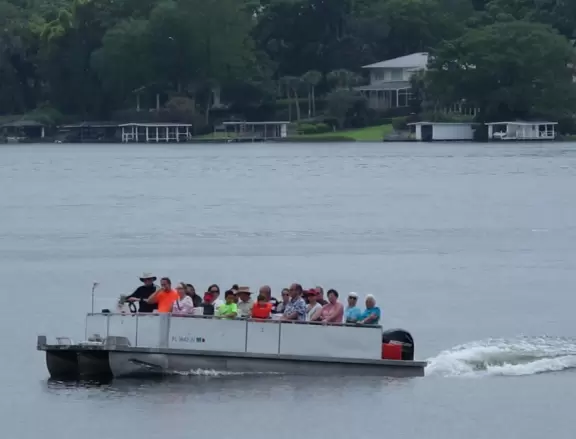 Gorgeous main street with large, European-style park where people sit on the grass by the fountain.