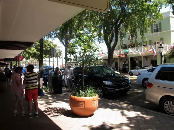 Three-block stretch of restaurants, under a canopy of trees, with sweet 1930s architecture.