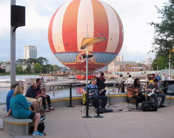 Waterfront area with restaurants, live street performers, entertainment, toy stores, and carousel.