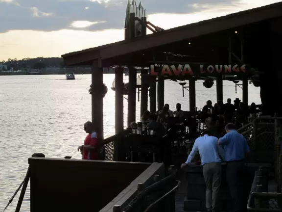 Waterfront area with restaurants, live street performers, entertainment, toy stores, and carousel.