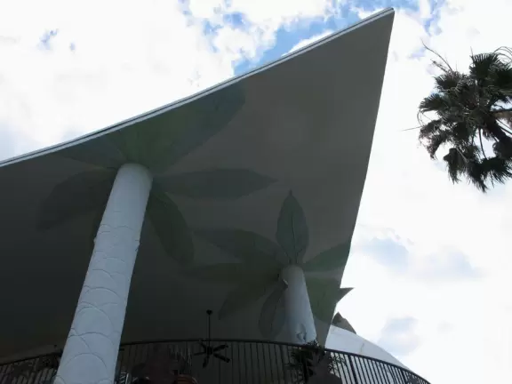 Waterfront area with restaurants, live street performers, entertainment, toy stores, and carousel.