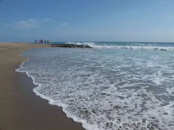 Ultra-shallow clear waters protected by a reef make this a perfect swimming spot for very young children.