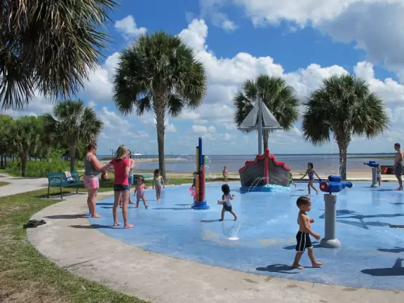 Splash pad right on the shore of a lake! Plus playground with huge shade cover.