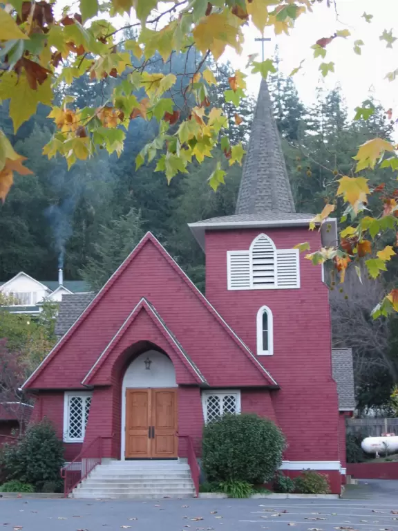 The cutest little town, backed by a forest.