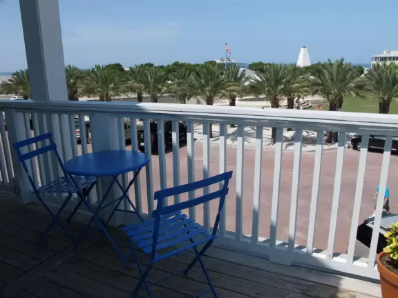 A cute town with high buildings that give shade, and a dreamy beach.