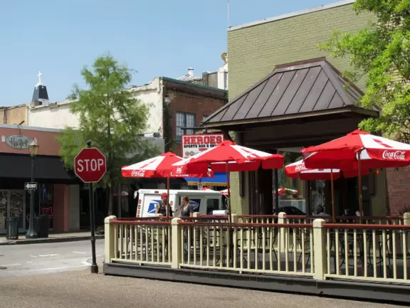 Main street in Mobile, with historic buildings with wrought-iron balconies.