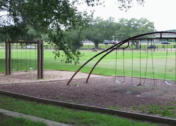 Modern children's museum with cars to race, model train town, ship to climb with basement to explore, and stage with songs to perform.