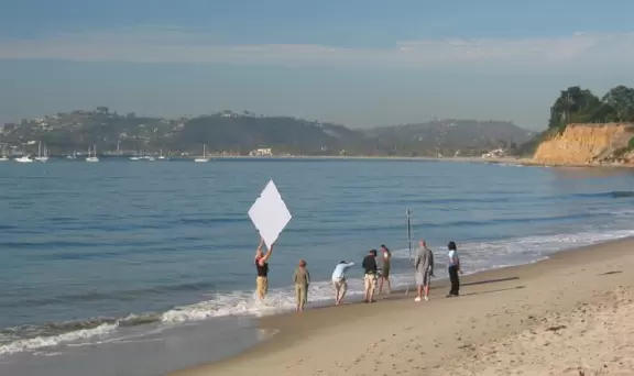 Beautiful beach with dark golden cliffs, a small boardwalk that's romantic at night, and visits by dolphins!