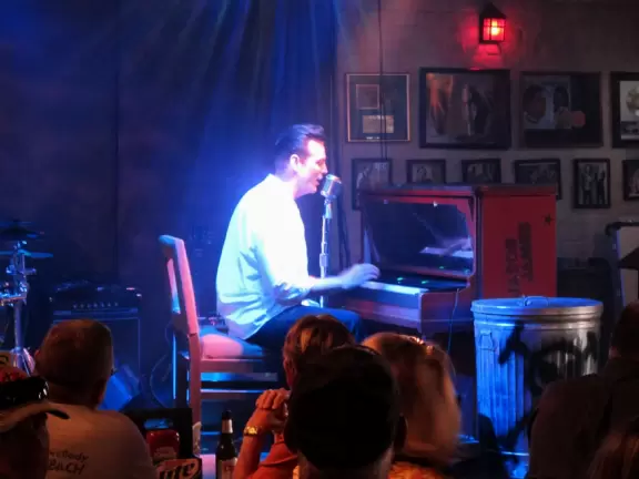 Happening, neon-lit spot for live music.