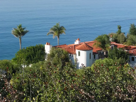 A drive along roads lined with hundreds of canary palms, through an old oak forest, past a clifftop lookout, amongst multimillion-dollar homes.