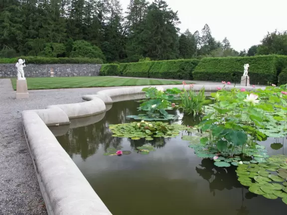 Grand estate with beautiful furnishings, countryside views, indoor pool, and gardens.
