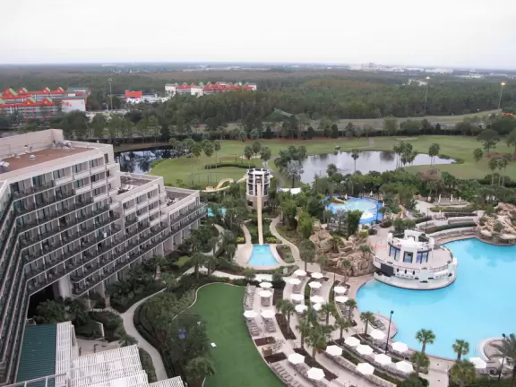 A paradise of waterfalls cascading into a huge heated pool, a splash pad, and a waterpark with lazy river.