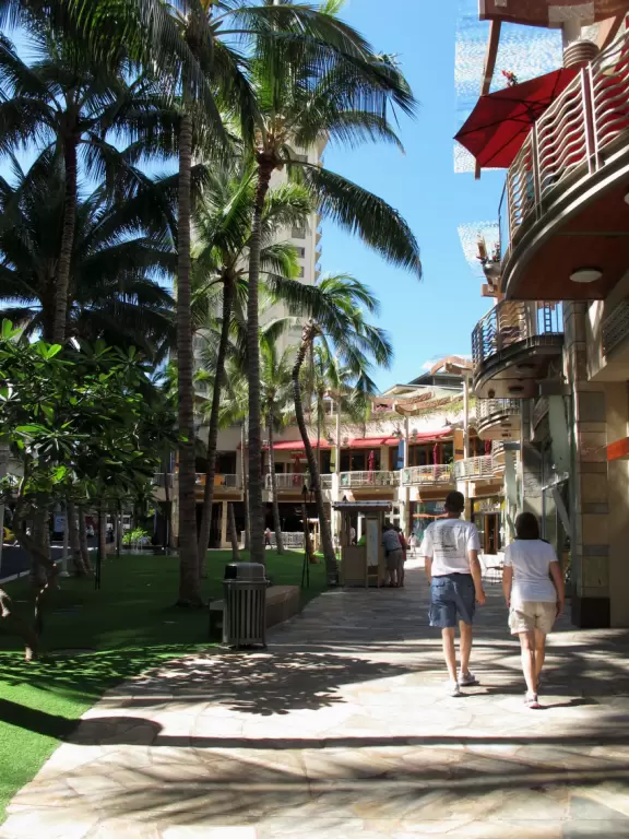 Awesome huge venue with wonderful breeze blowing through balcony, wood floors, guitars on high ceiling, and pink wave wall.
