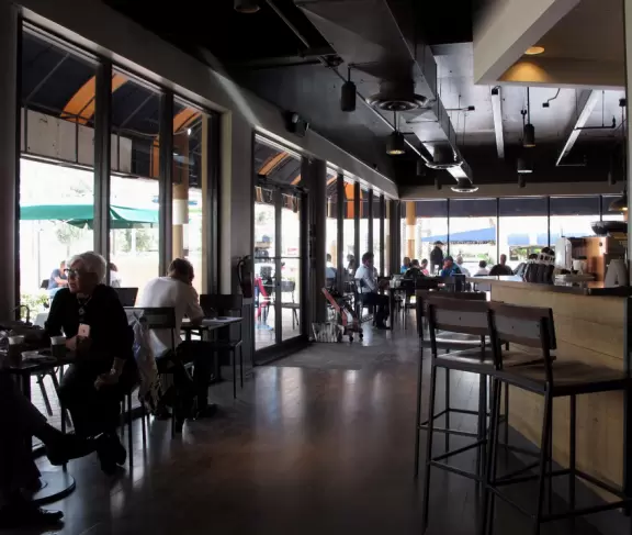 A great little plaza across the street from impressive modern skyscrapers and the beach.