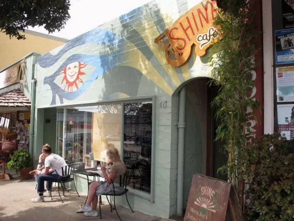 A lovely, hilly street with ocean views, lined with cute cafes.