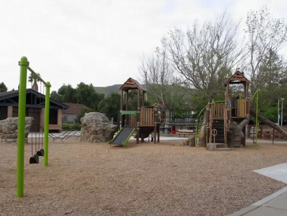 A pretty park with imaginative playground, lawn, amazing skatepark with a wave, basketball/roller derby court, and shady picnic areas. Currently a crime problem.