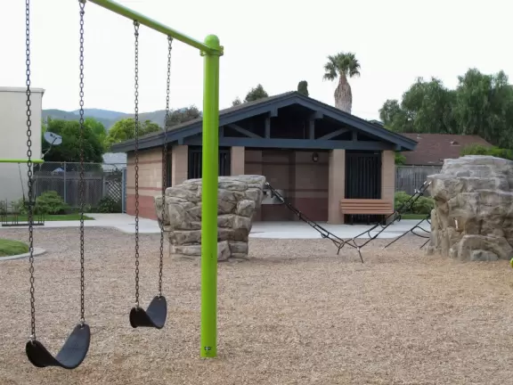 A pretty park with imaginative playground, lawn, amazing skatepark with a wave, basketball/roller derby court, and shady picnic areas. Currently a crime problem.