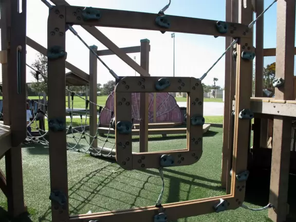 Imaginative beach-themed pseudo-wood playground, with tons of cool play equipment!