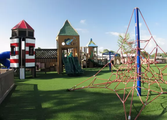 Imaginative beach-themed pseudo-wood playground, with tons of cool play equipment!