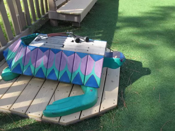 Imaginative beach-themed pseudo-wood playground, with tons of cool play equipment!