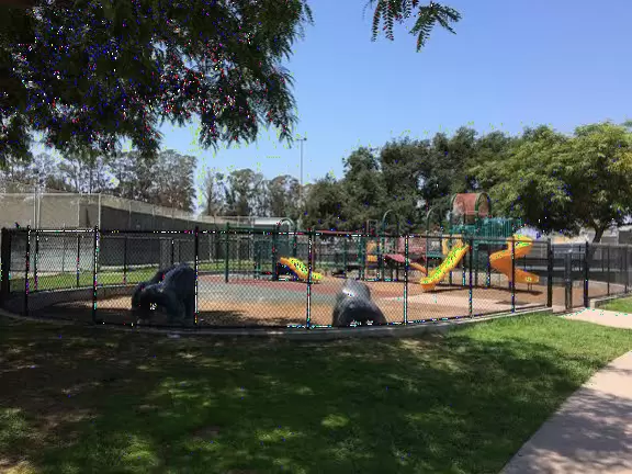 Playground with three gorilla sculptures kids can climb, twisty slide, many stepping stones, steering wheels, bouncing bridge, and rope climby.