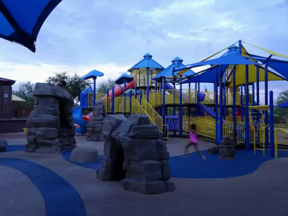 An attractive housing development with a super-fun huge community playground, a splash pad for summer days, and a waterslide park!