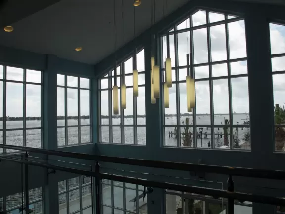 Two-level modern winter manatee viewing center with walkway by the water.