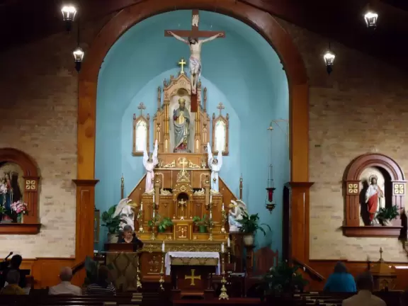 Adorable square with basilica, bandstand, cute shops, cafes with adobe walls and flowers.