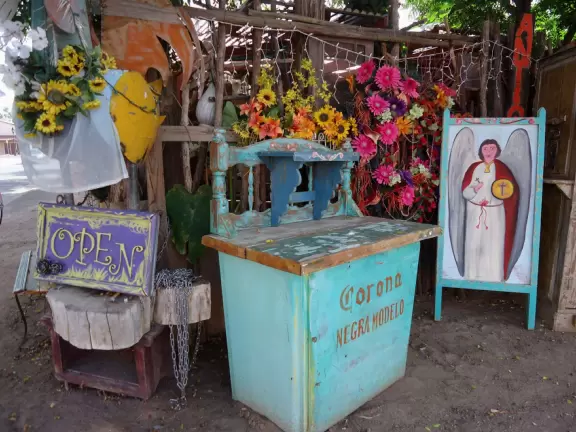 Adorable square with basilica, bandstand, cute shops, cafes with adobe walls and flowers.